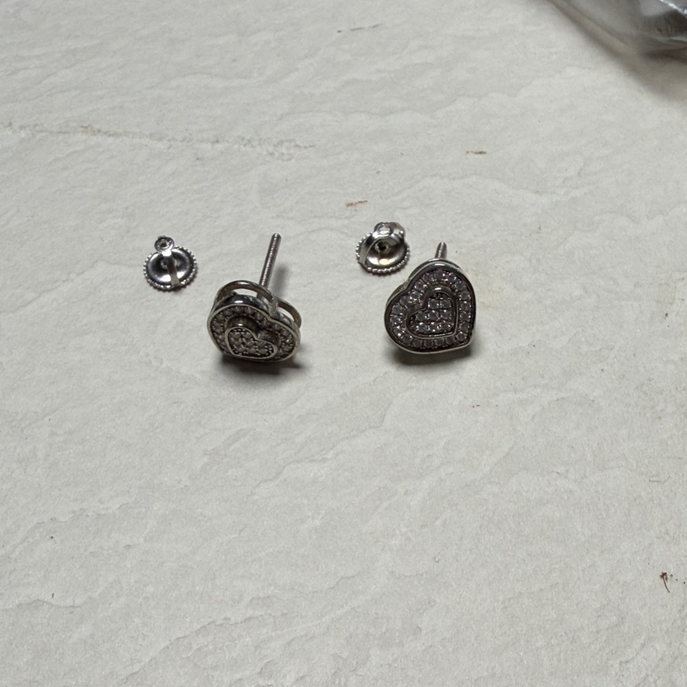 Brand new. Heart Shaped Silver Stud Earrings